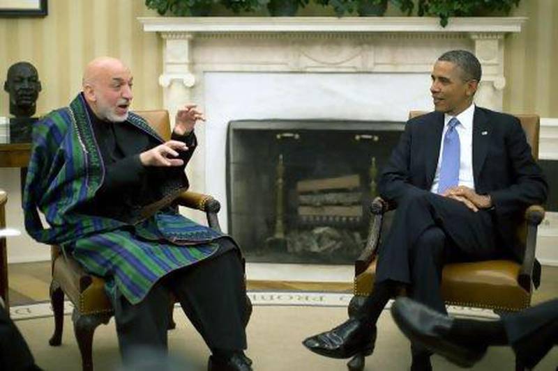 US President Barack Obama meets his Afghan counterpart Hamid Karzai in the Oval Office on Friday to discuss US troop deployments.