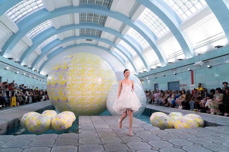 A model presents a creation by fashion designer Susan Fang on the fifth day of London Fashion Week. AFP