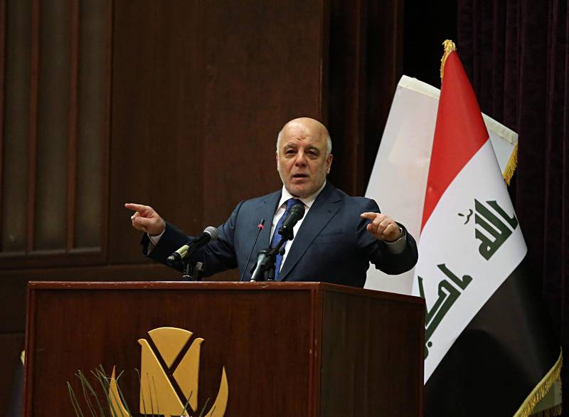 Iraq Prime Minister Haider al-Abadi  gestures, during a press conference, in Baghdad, Iraq, Saturday, Dec. 9, 2017. Iraq said Saturday that its war on the Islamic State is over after more than three years of combat operations drove the extremists from all of the territory they once held. -Abadi announced Iraqi forces were in full control of the country's border with Syria during remarks at a conference in Baghdad, and his spokesman said the development marked the end of the military fight against IS. (AP Photo/Karim Kadim)