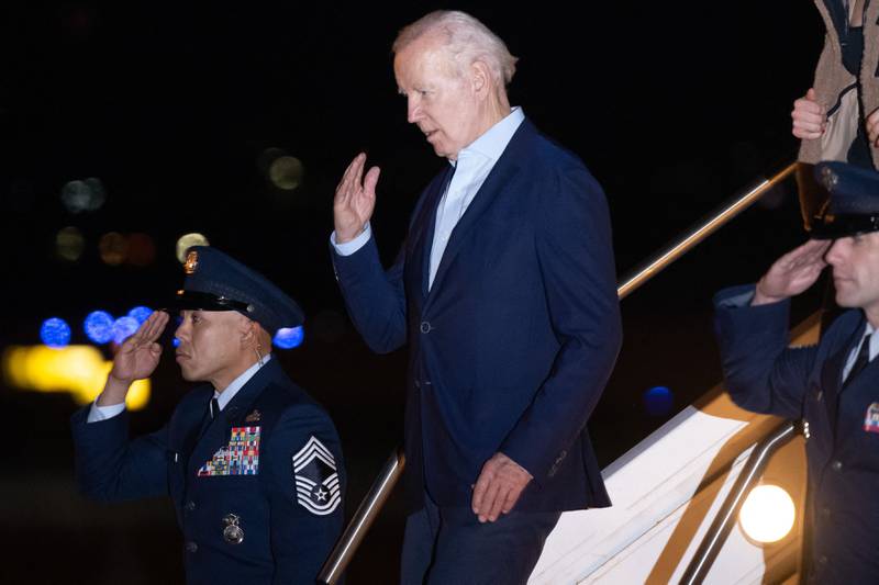 Mr Biden salutes while disembarking Air Force One. AFP
