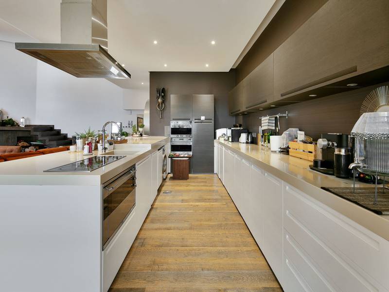 The custom-designed kitchen has built in appliances.