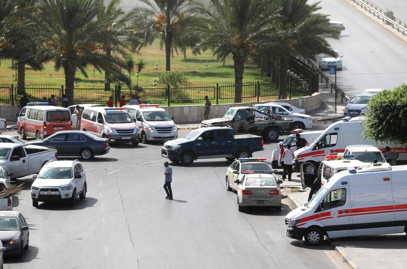 Ambulances and security vehicles. Reuters