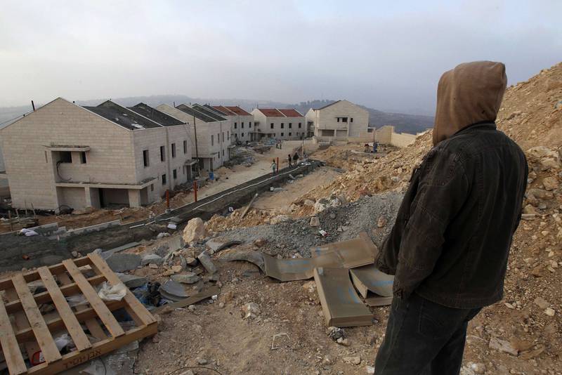 A Palestinian labourer stands on a construction site in the West Bank Jewish settlement of Givat Zeev, near Jerusalem. Reuters