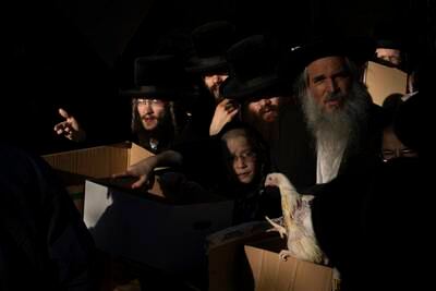 Ultra-Orthodox Jews buy chickens for the Kaparot ritual in Bnei Brak, Israel. AP