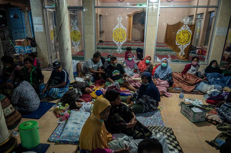 People who fled the volcano take shelter at the local mosque of Sumber Wuluh village, in Lumajang. AFP