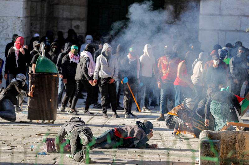 Israeli police use force on Palestinian demonstrators at Al Aqsa Mosque compound in Jerusalem. AFP