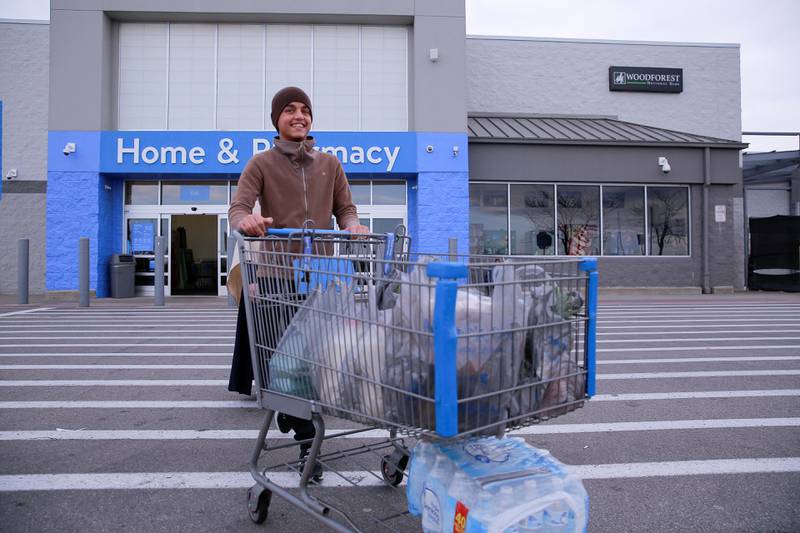 An Afghan refugee goes grocery shopping in the US. Reuters