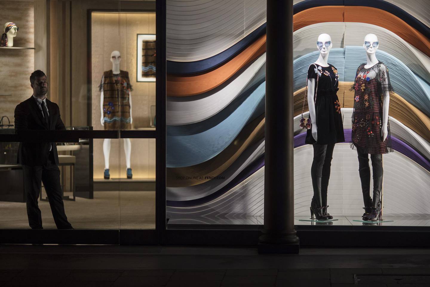 A security guard stands at the entrance to a Fendi SpA luxury goods store on New Bond Street in London, U.K., on Thursday, Oct. 27, 2016. Multiple reports show consumer confidence falling and a weakening of households’ spending power likely leading to a jump in inflation, which some economists see reaching 3 percent next year. Photographer: Simon Dawson/Bloomberg