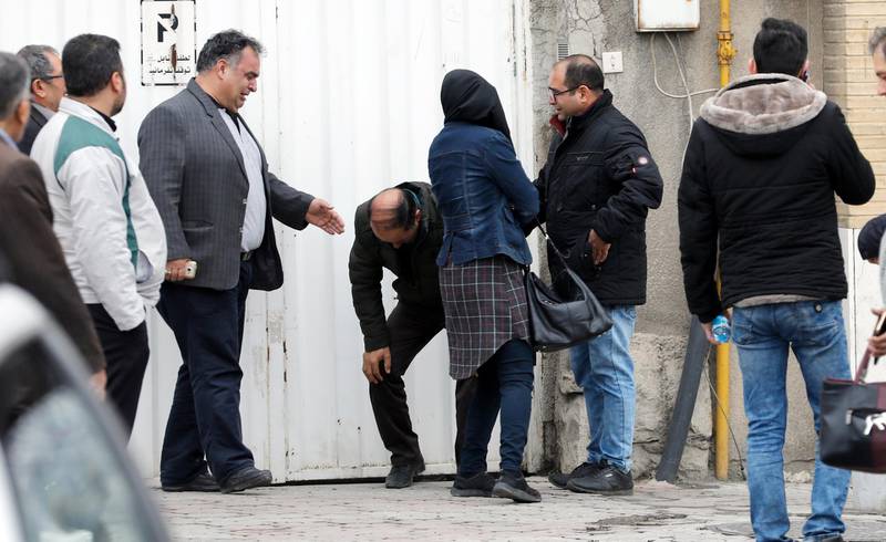 epa06539183 A man (C) is overcome by emotions as a group of relatives of passengers of an Iran Aseman Airline flight gathers around a mosque at the Mehr-Abad airport in Tehran, Iran, 18 February 2018. Media reported that a plane of Aseman Air crashed with around 60 passengers near Semirom, around the city of Isfahan. Reportedly all passengers are feared dead when the plane crashed in a mountainous region on its way from Tehran to Yassuj in South western Iran.  EPA/ABEDIN TAHERKENAREH