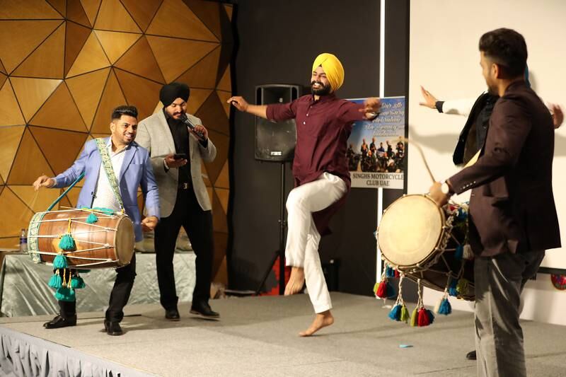 Participants perform Bhangra, a traditional folk dance from the Punjab region in India.