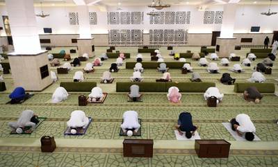 Saudis preform prayers at a mosque in Jeddah. Saudi Arabia has allowed the reopening of mosques to prayer while observing social distance on May 31.  EPA