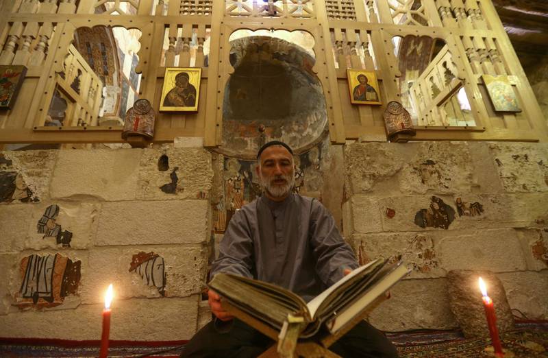 Father Jihad Youssef sits in prayer and contemplation at the monastery.
