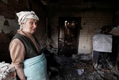 Hanna Selivon, 77, surveys what remains of her house, which she says was destroyed by Russian shelling on the outskirts of Chernihiv, Ukraine. Reuters