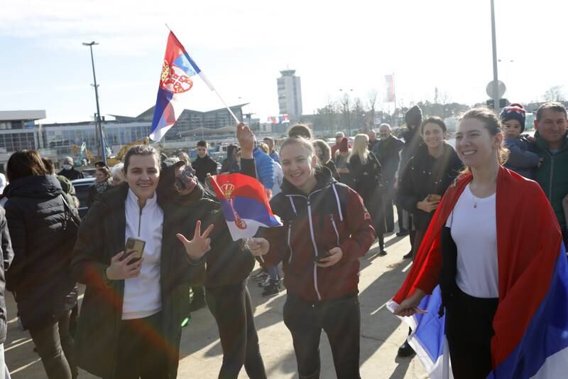Supporters Novak Djokovic gather at the Nikola Tesla Airport in Belgrade. EPA