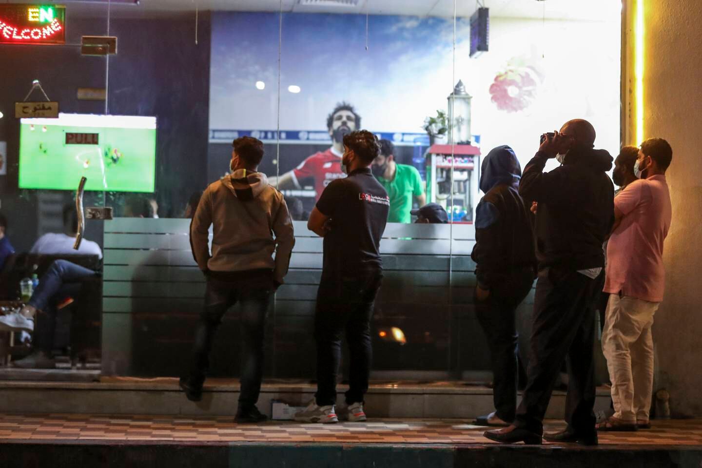 Fans in Abu Dhabi watch the Africa Cup of Nations in February.  Shisha restaurants will be popular spots for fans watching the World Cup this year.  Khushnum Bhandari / The National