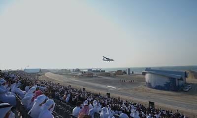 A plane flies overhead at the Union Fortress military parade. Abu Dhabi Media Office