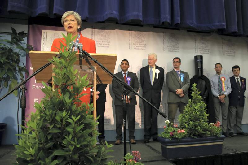 British Prime Minister Theresa May speaks after winning her seat at the count centre in Maidenhead early in the morning of June 9, 2017, hours after the polls closed in Britain's general election. - Prime Minister Theresa May is poised to win Britain's snap election but lose her parliamentary majority, a shock exit poll suggested on June 8, in what would be a major blow for her leadership as Brexit talks loom. The Conservatives were set to win 314 seats, followed by Labour on 266, the Scottish National Party on 34 and the Liberal Democrats on 14, the poll for the BBC, Sky and ITV showed. (Photo by Geoff CADDICK / AFP)