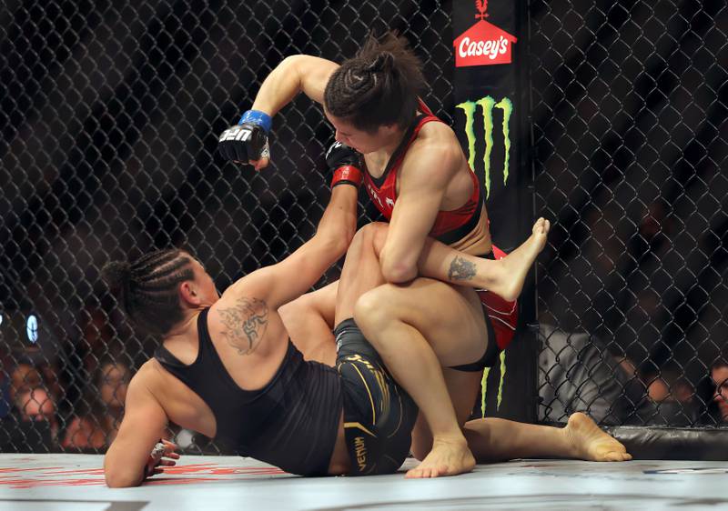 Weili Zhang throws a punch at Carla Esparza during their Women Strawweight fight at UFC 281. Getty