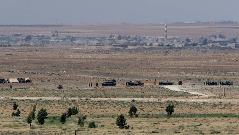 Military vehicles stand near a section of the Jordan-Syria border in the Jordanian governorate of Mafraq. AFP