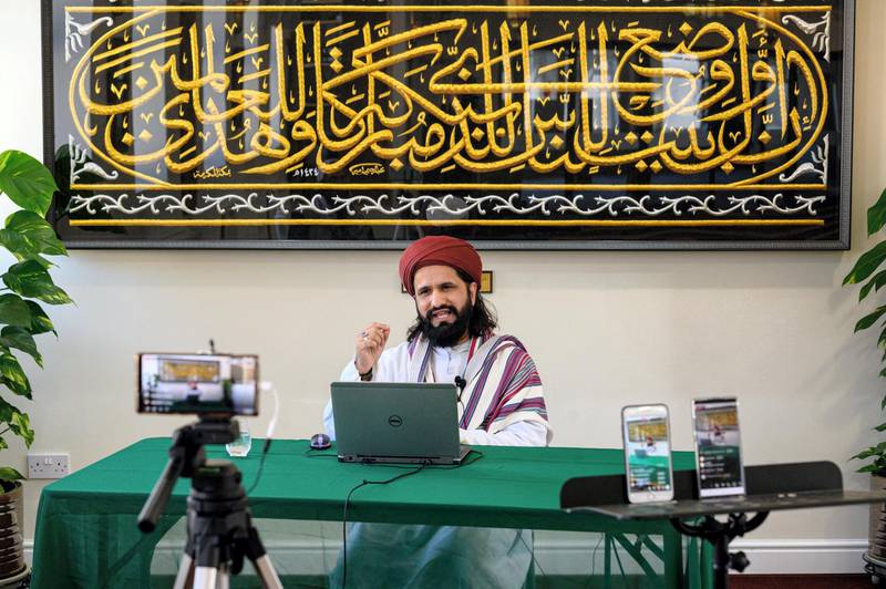 Imam Hassanat Ahmed delivers his Friday broadcast entitled 'Preparing for a Unique Ramadan' via multiple social media platforms from the otherwise empty Noor Ul Islam Mosque on the day before Ramadan commences in the UK, in Bury, Greater Manchester on April 24, 2020. - The mosque, like all religious venues, has been closed to worshipers during the national lockdown due to the novel coronavirus COVID-19 pandemic. (Photo by OLI SCARFF / AFP)