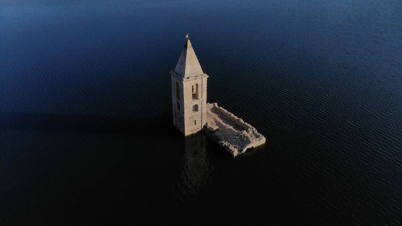 The Church of Sant Roma, visible due to the low water level of the Sau reservoir, in Vilanova de Sau, Catalonia, Spain. The reservoir, completed in 1962, covered the town of Sant Roma de Sau. AFP