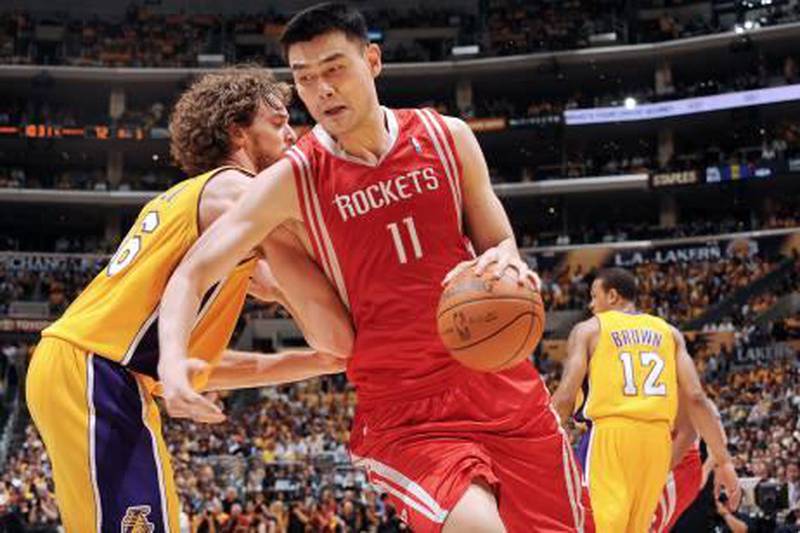 LOS ANGELES - MAY 4: Yao Ming #11 of the Houston Rockets makes a move against Pau Gasol #16 of the Los Angeles Lakers in Game One of the Western Conference Semifinals during the 2009 NBA Playoffs at Staples Center on May 4, 2009 in Los Angeles, California. NOTE TO USER: User expressly acknowledges and agrees that, by downloading and/or using this Photograph, user is consenting to the terms and conditions of the Getty Images License Agreement. Mandatory Copyright Notice: Copyright 2009 NBAE   Andrew D. Bernstein/NBAE via Getty Images/AFP