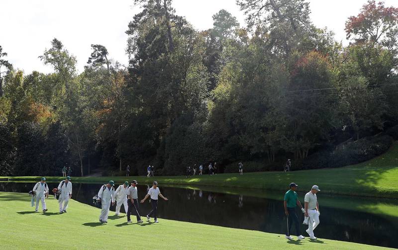 Tiger Woods, Justin Thomas, Bryson DeChambeau and Fred Couples walk on the 16th hole during a practice round prior to the Masters. AFP
