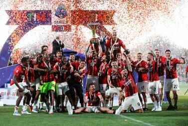 Milan's players celebrate with the trophy after winning the Italian Serie A championship title following the Italian Serie A soccer match US Sassuolo vs AC Milan at Mapei Stadium in Reggio Emilia, Italy, 22 May 2022 (issued 23 May 2022).   EPA / ELISABETTA BARACCHI