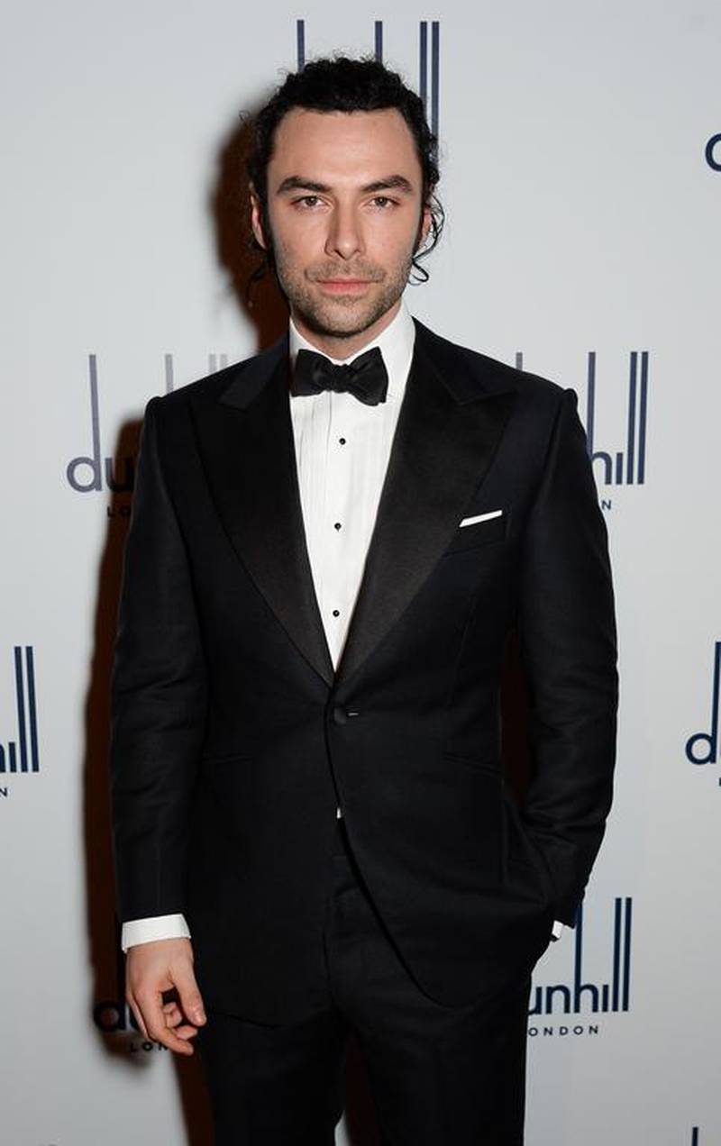 Aidan Turner wore an Alfred Dunhill bespoke dinner jacket and white formal shirt with a white pocket square. Courtesy dunhill