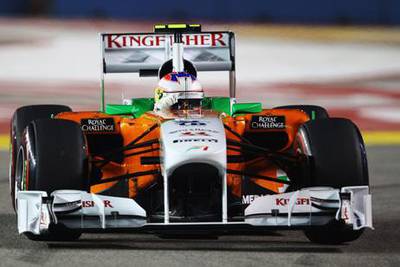 SINGAPORE - SEPTEMBER 24:  Paul di Resta of Great Britain and Force India drives during qualifying for the Singapore Formula One Grand Prix at the Marina Bay Street Circuit on September 24, 2011 in Singapore.  (Photo by Vladimir Rys/Getty Images)