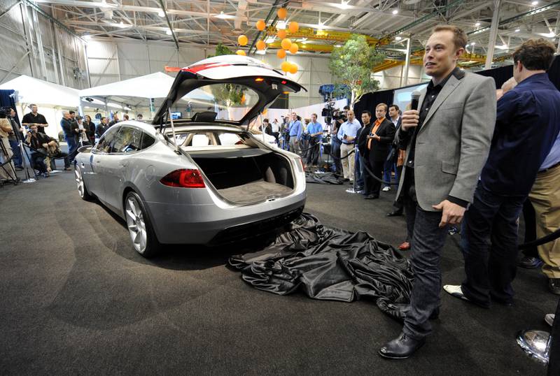 Mr Musk answers questions about the new Tesla Model S all-electric car, at its unveiling in Hawthorne, California, in 2009 AFP