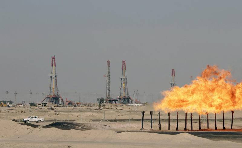Excess gas is burnt off at a pipeline at the Rumaila oilfield in Basra, southern Iraq. Reuters