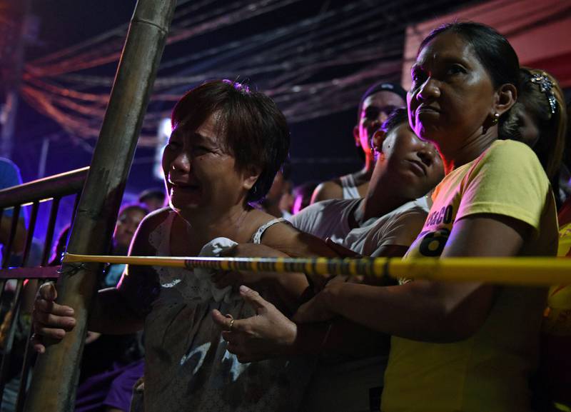 Tears behind the police cordon after a drug-related shooting by men on motorbikes at Navotas in Metro Manila. Reuters