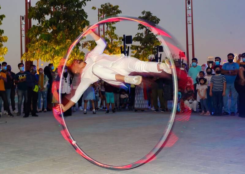 A performer entertains crowds at the opening of Ain Dubai