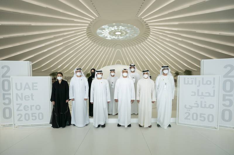 Sheikh Mohamed bin Zayed, Crown Prince of Abu Dhabi and Deputy Supreme Commander of the Armed Forces, front row, third right, at the launch of the UAE’s Net Zero 2050 Strategic Initiative at Expo 2020 Dubai. With the Crown prince are, front row: Sheikh Mansour bin Zayed, Deputy Prime Minister and Minister of Presidential Affairs, second right, Sheikh Maktoum bin Mohammed Al Maktoum, Deputy Prime Minister and Minister of Finance, fourth right, Dr Sultan Al Jaber, Minister of Industry and Advanced Technology, right, Mohamed Al Gergawi, Minister of Cabinet Affairs, fifth right, and Mariam Al Mheiri, Minister for Climate Change and Environment, left. Back row, from right to left: Abdullah Al Marri, Minister of Economy, Suhail bin Mohamed Al Mazrouei, Minister of Energy and Infrastructure, and  Reem Al Hashimi, Minister of State for International Co-operation and Director General of Expo 2020 Dubai.