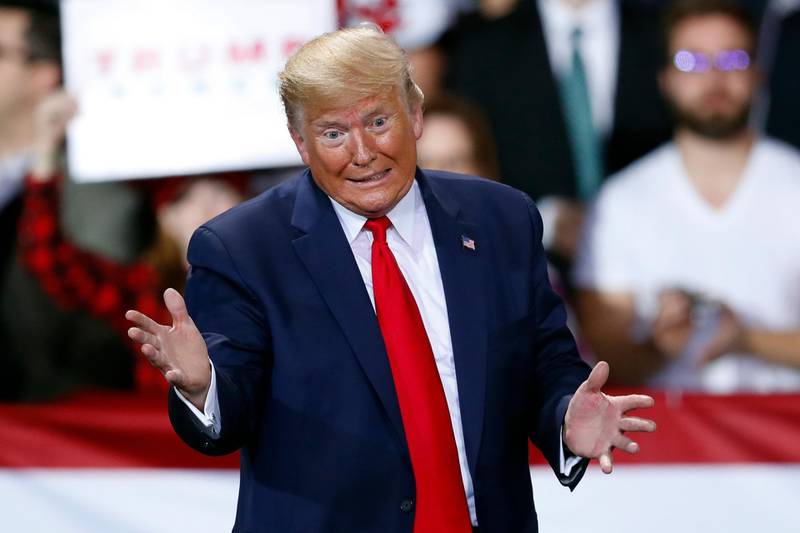 In this Dec. 18, 2019, photo, President Donald Trump speaks at a campaign rally in Battle Creek, Mich. Using stark â€œUs versus Themâ€ language, Trump and his campaign are trying to frame impeachment not as judgment on his conduct but as a culture war referendum on him and his supporters, aiming to motivate his base heading into an election year (AP Photo/Paul Sancya)