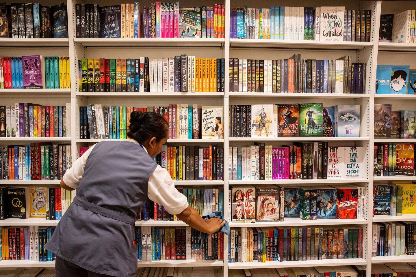 A worker cleans in the Kinokuniya Co. book store at the Aeon Mall in Phnom Penh, Cambodia, Sunday, May 26, 2019. Kinokuniya, Japan's largest bookstore chain, opened their first store in the Shinjuku district of Tokyo in January 1927 and now have over 80 stores worldwide, according to the company's website. Photograph: Taylor Weidman/Bloomberg