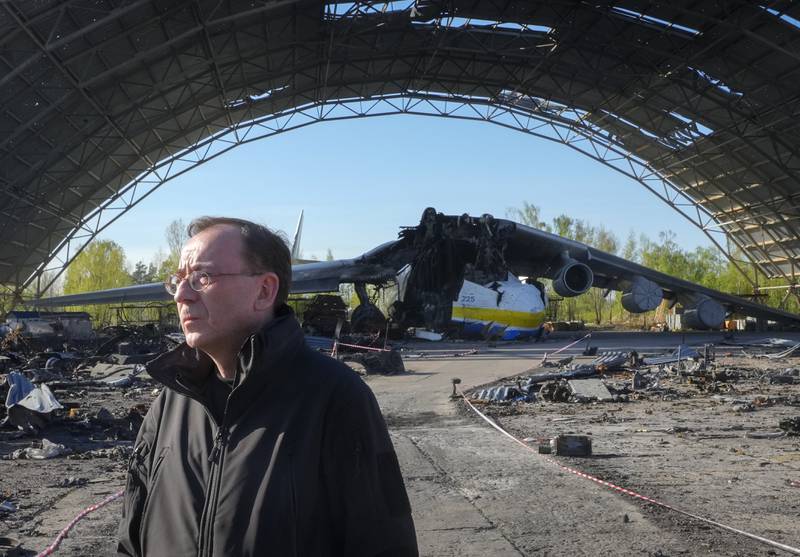 Poland's Minister of Interior and Administration Mariusz Kaminski stands near the heavily damaged plane on the outskirts of Kyiv. AP