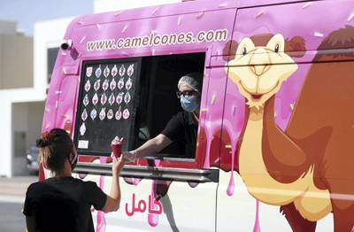Dubai, United Arab Emirates - Reporter: N/A. Standalone. Coronavirus/Covid-19. A lady receives her ice cream on a hot day in Dubai. Saturday, September 5th, 2020. Dubai. Chris Whiteoak / The National