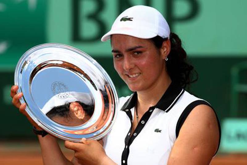 PARIS, FRANCE - JUNE 05:  Champion Ons Jabeur of Tunisia poses with the trophy following her victory during the girl's singles final match between Ons Jabeur of Tunisia and Monica Puig of Puerto Rica on day fifteen of the French Open at Roland Garros on June 5, 2011 in Paris, France.  (Photo by Alex Livesey/Getty Images)