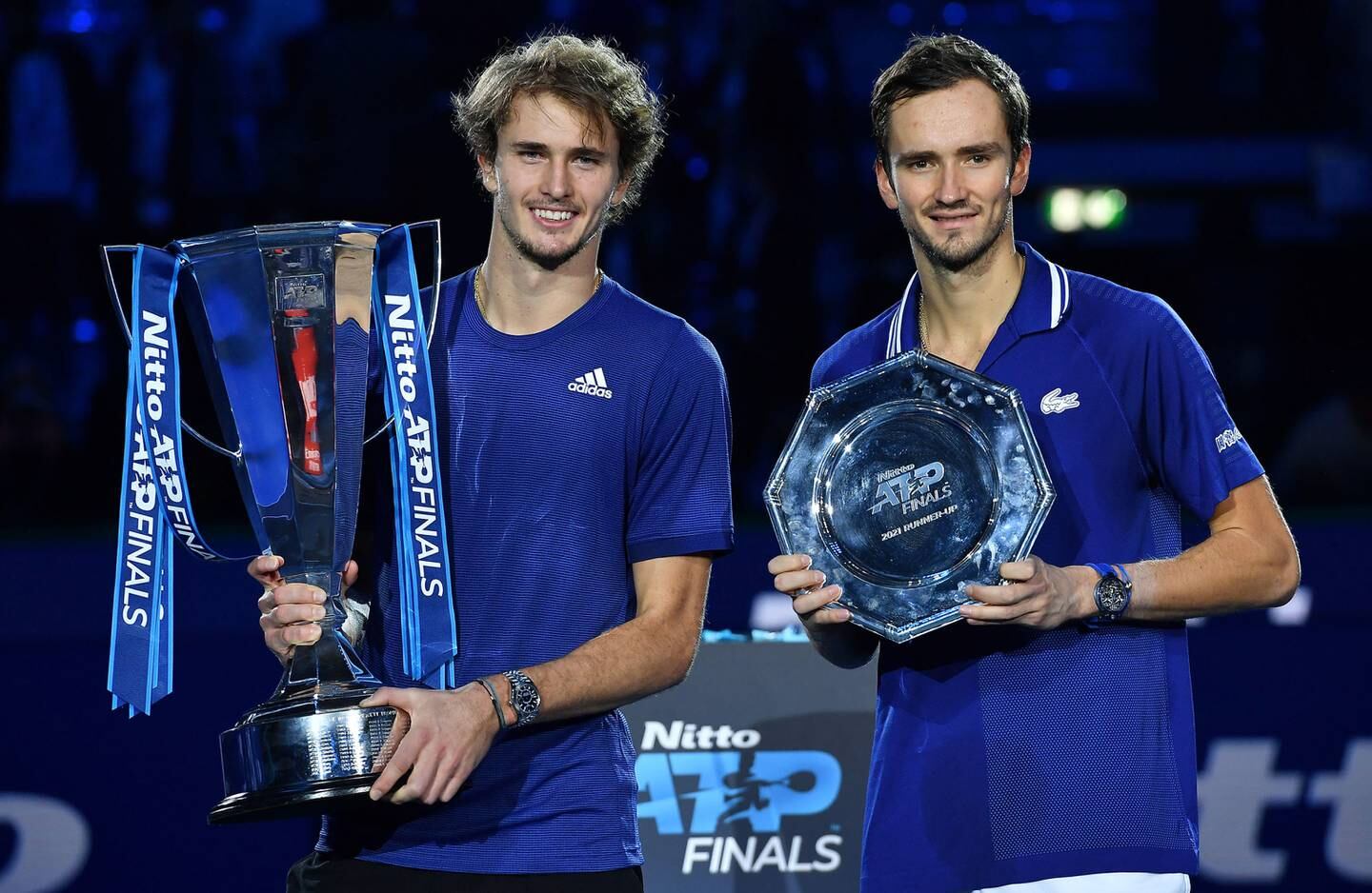 Alexander Zverev (L) of Germany poses with the trophy after winning the final match against Daniil Medvedev of Russia at the Nitto ATP Finals tennis tournament in Turin, Italy. EPA.