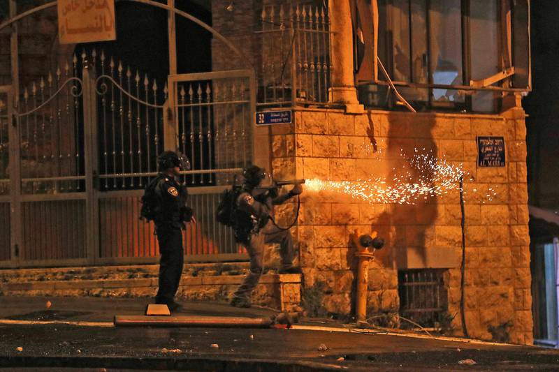 Israeli security forces fire tear gas at protesters the Shuafat camp for Palestinian refugees, in East Jerusalem. AFP
