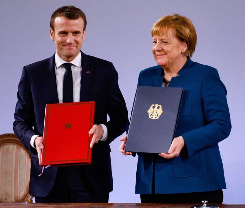AACHEN, GERMANY - JANUARY 22: German Chancellor Angela Merkel and French President Emmanuel Macron sign the Aachen Treaty on January 22, 2019 in Aachen, Germany. The treaty is meant to deepen cooperation between the countries as a means to also strengthen the European Union. It comes 56 years to the day after then German Chancellor Konrad Adenauer und French President Charles de Gaulle signed the Elysee Treaty, or Joint Declaration of Franco-German Friendship. (Photo by Sascha Schuermann/Getty Images)