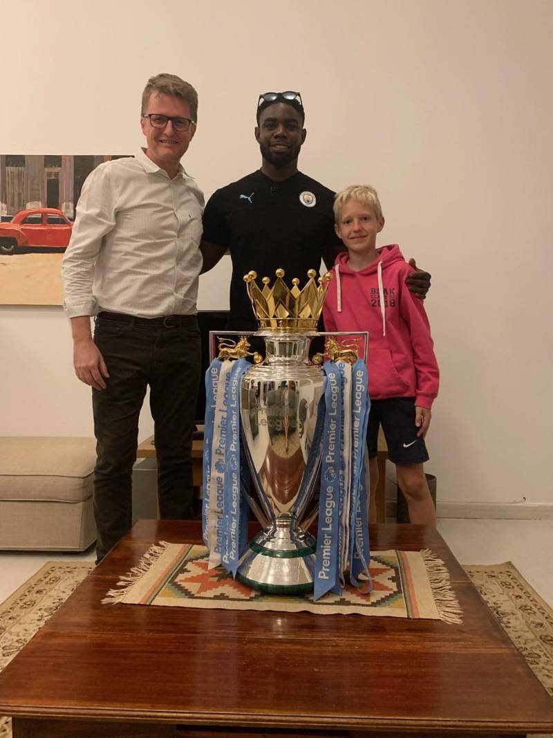 Nick March, Assistant Editor-in-Chief at The National, with his son Robert, right, and Micah Richards. Courtesy Nick March