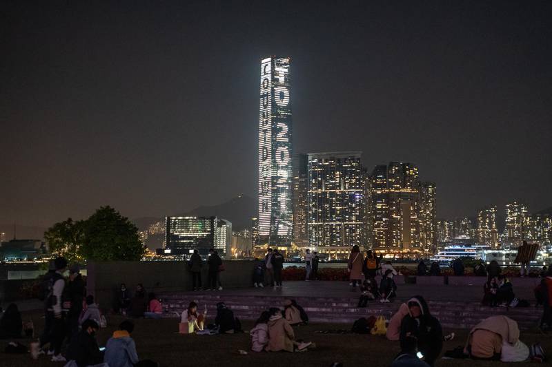 People celebrate at Tamar Park on New Year's Eve in Hong Kong, China. Bloomberg