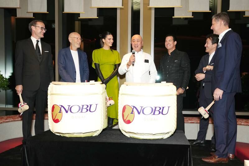 Kendall Jenner, centre left, and Nobu Matsuhisa, centre right, at the opening of Nobu Dubai at Atlantis, The Palm on Friday. All photos: Getty Images