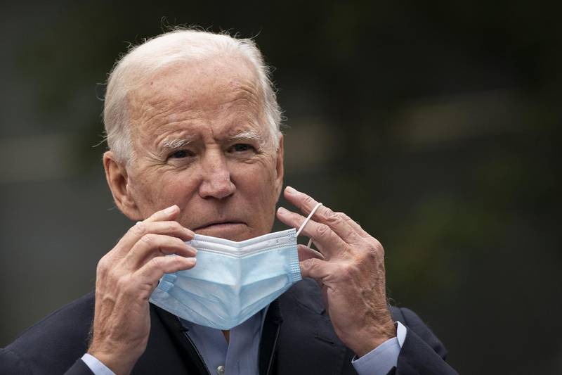 CHESTER, PA - OCTOBER 26: Democratic presidential nominee Joe Biden puts on a face mask while speaking to reporters at a voter mobilization center on October 26, 2020 in Chester, Pennsylvania. In Pennsylvania, Tuesday, October 27 is the last day to request a mail-in ballot or to vote early in person.   Drew Angerer/Getty Images/AFP
== FOR NEWSPAPERS, INTERNET, TELCOS & TELEVISION USE ONLY ==
