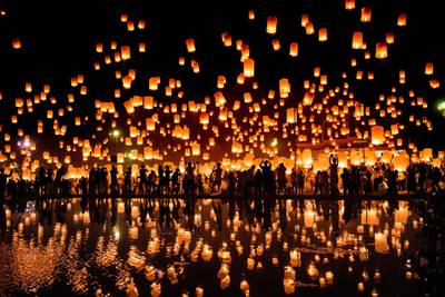 Revellers release lanterns into the air in celebration of the Yee Peng festival in Chiang Mai, Thailand. Roberto Schmidt / AFP Photo / November 3, 2017