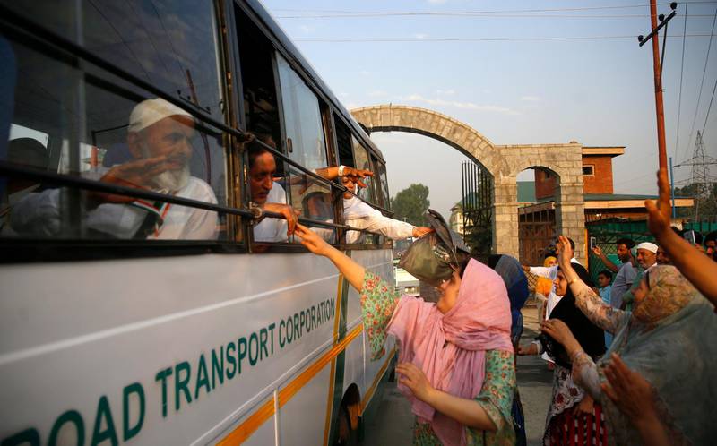 Relatives see off pilgrims heading to Makkah in Srinagar.  EPA