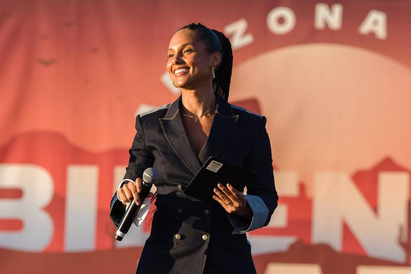 Singer Alicia Keys speaks to the crowd before introducing Senator from California and Democratic vice presidential nominee Kamala Harris during a drive-in campaign rally in Phoenix, Arizona on October 28, 2020. (Photo by ARIANA DREHSLER / AFP)